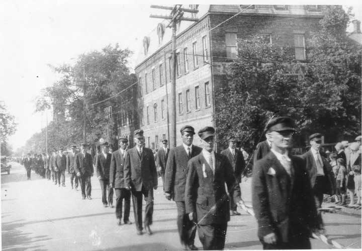 Parade on Kent Street with W.E. Dawson Building in background, undated, Courtesy of the Public Archives and Records Office